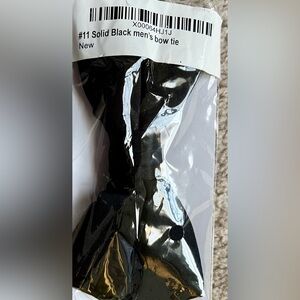 Men’s solid black bow tie still sealed in original bag